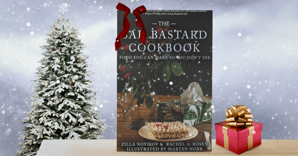 A very Christmas sad bastard cookbook. The book next to a tree and a present, plus it's snowing.